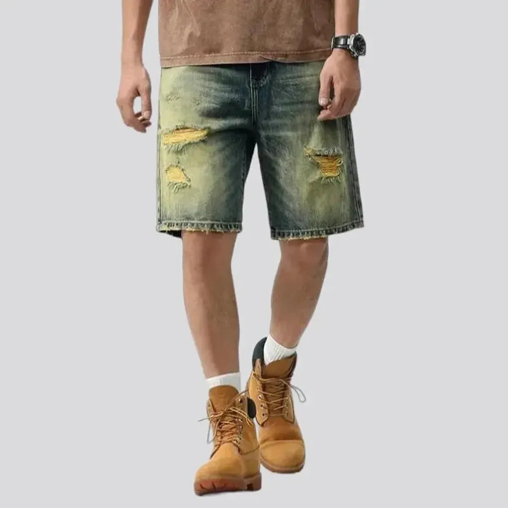 Yellow-cast distressed denim shorts for men