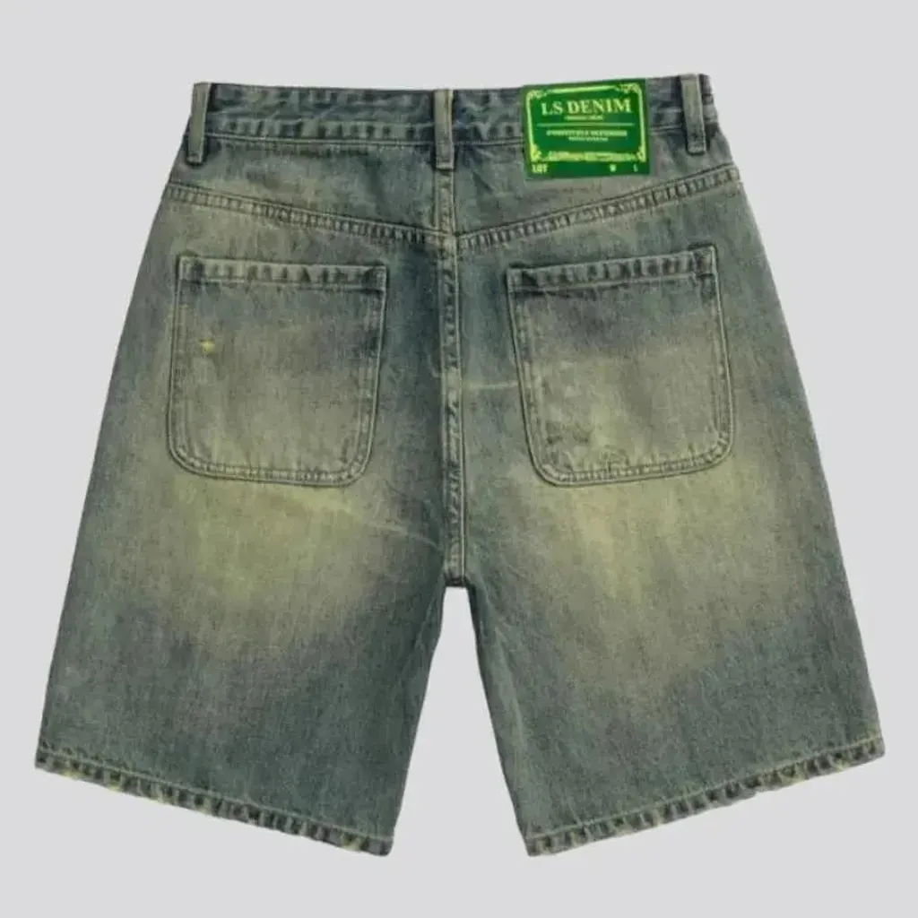 Yellow-cast distressed denim shorts for men