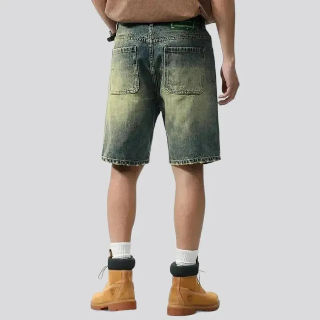 Yellow-cast distressed denim shorts for men